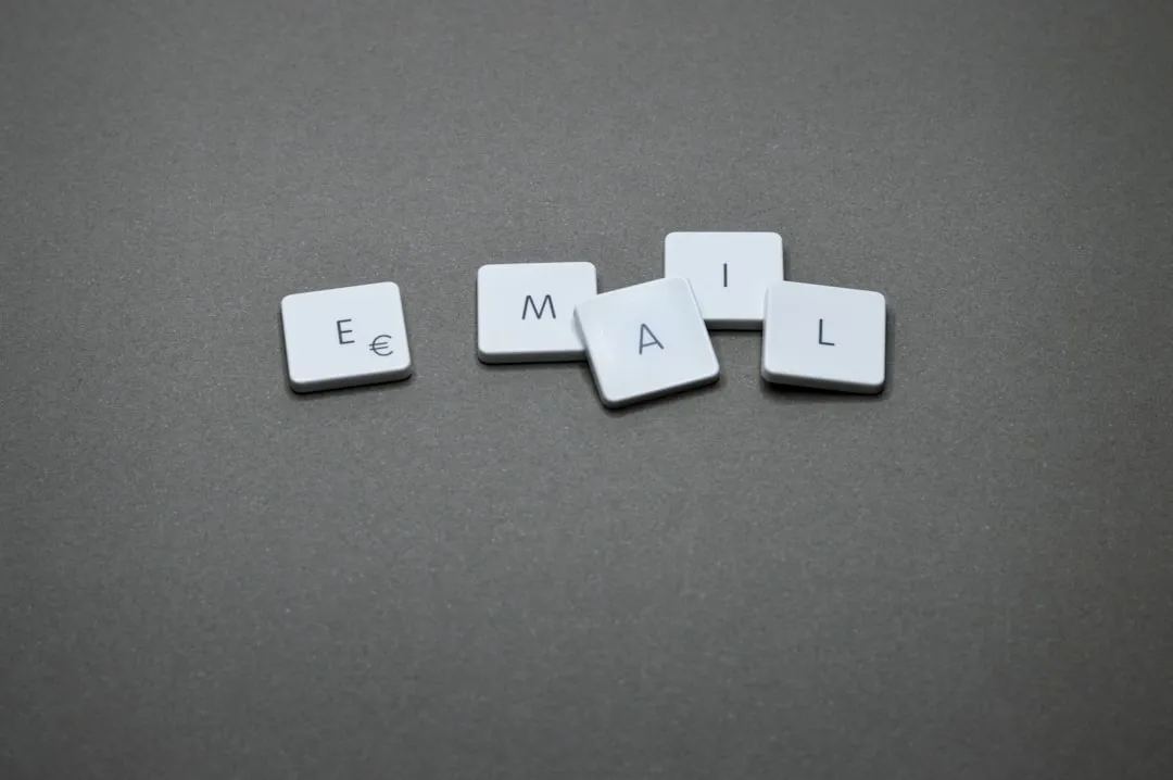 The word "email" is spelled out with letter tiles.